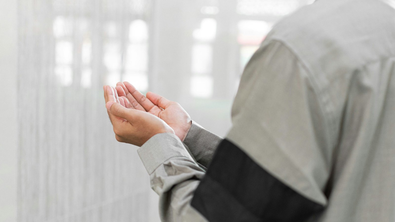 a man holding his hands together